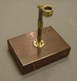 Simple microscope. This type of microscope was primarily used for dissection, and is equipped with a scalpel and other tools. Ca. 1830.